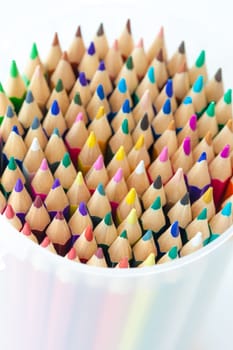 Many colorful pens arranged round with text space