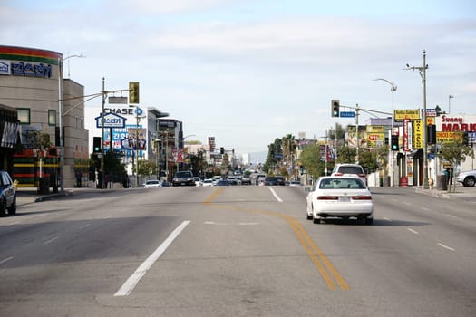 Los Angeles,United States - December 27,2015: Road traffic on a main street in Koreatown with various shops and stores on December 27,2015 in Los Angeles.