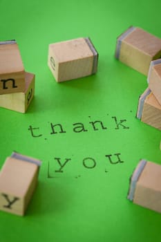Thank you with stamps on green background