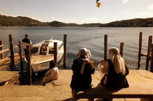 the island isola san giulio orta in front of the historic center of the traditional fishing village of orta on lake orta in north of piedmont in the north of italy. (urs flüeler)