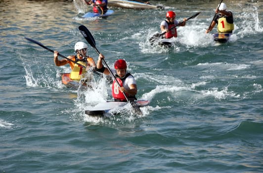 a Water Kanu Ball Game in the Harbour in the old town of Siracusa in Sicily in south Italy in Europe.