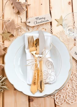 Vintage cover for Christmas with golden cutlery