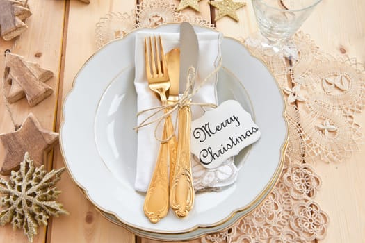 Vintage cover for Christmas with golden cutlery