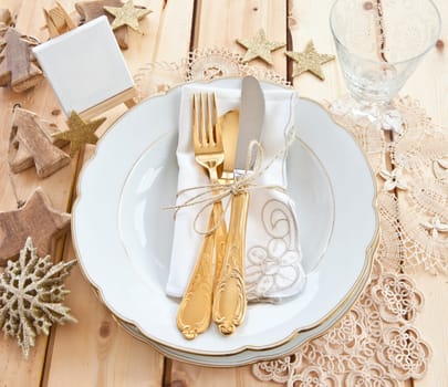 Vintage cover for Christmas with golden cutlery