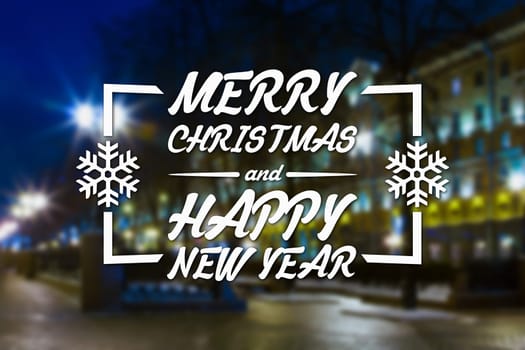 Merry Christmas and New Year greeting card on blurred night city streets illuminated buildings background