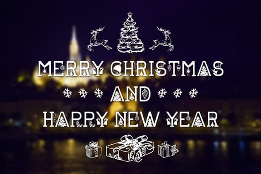 Merry Christmas and New Year hand drawing greeting card on blurred night city illuminated old buildings with reflection in water background
