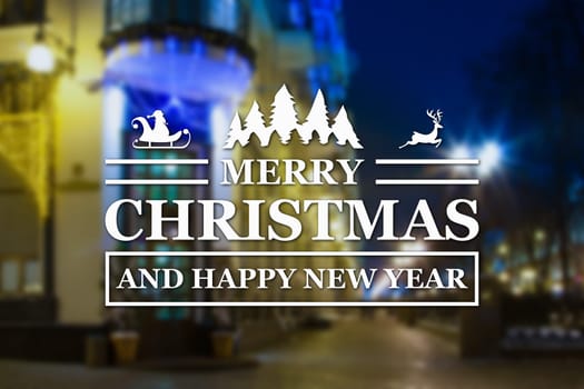 Merry Christmas and New Year greeting card on blurred night city streets illuminated buildings background