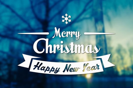 Merry Christmas and New Year greeting card on blurred tree and icicle at sunset blue colored background