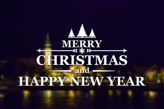 Merry Christmas and New Year greeting card on blurred night city illuminated old buildings with reflection in water background