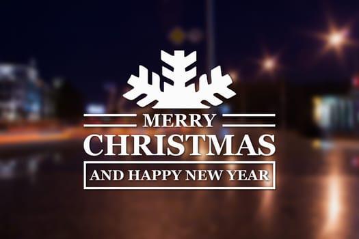 Merry Christmas and New Year greeting card on blurred night city streets illuminated buildings background
