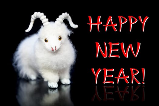 New Year greeting card or postcard with white goat or sheep toy the chinese symbol of 2015 year on black background with reflection