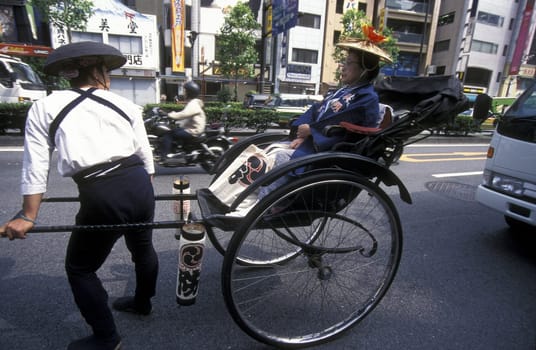 a Riksha at the big festival in the Asakusa Senso Ji temple in the city center of Tokyo in Japan in Asia,....