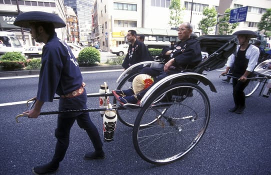 a Riksha at the big festival in the Asakusa Senso Ji temple in the city center of Tokyo in Japan in Asia,....