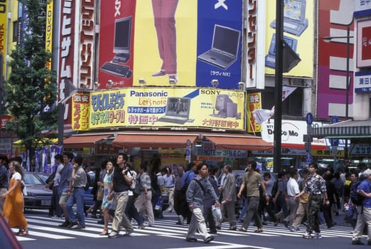 A Road with Shopping and Trafic in the City centre of Tokyo in Japan in Asia,....