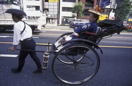 a Riksha at the big festival in the Asakusa Senso Ji temple in the city center of Tokyo in Japan in Asia,....