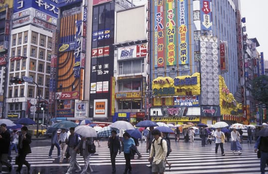 A Road with Shopping and Trafic in the City centre of Tokyo in Japan in Asia,....