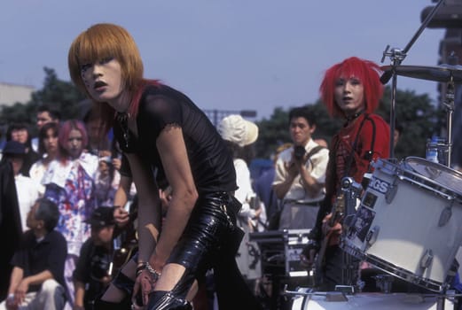 a Japanese Youth Punk Band plays on a square in the City of Tokyo in Japan in Asia,....