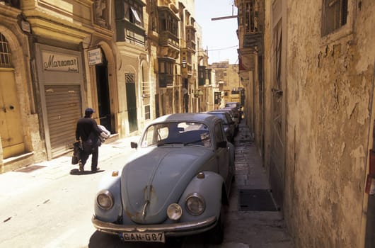 A smal road in the centre of the Old Town of the city of Valletta on the Island of Malta in the Mediterranean Sea in Europe..