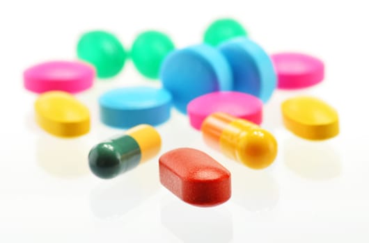 Composition with variety of drug pills and container
