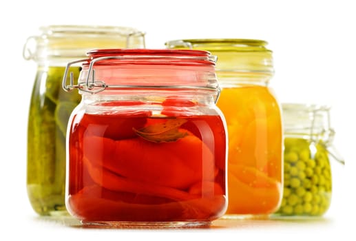 Jars with pickled vegetables and fruity compotes isolated on white background. Preserved food