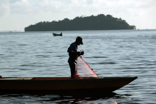 a fishermen on the coast near the city of Bandar seri Begawan in the country of Brunei Darussalam on Borneo in Southeastasia.