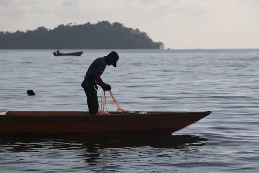 a fishermen on the coast near the city of Bandar seri Begawan in the country of Brunei Darussalam on Borneo in Southeastasia.