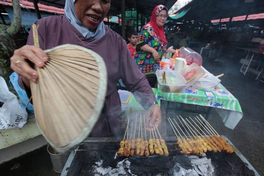 grill at the market in the city center in the city of Bandar seri Begawan in the country of Brunei Darussalam on Borneo in Southeastasia.