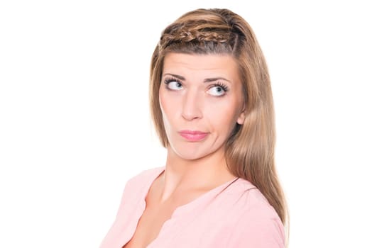 Astonished young woman against a white background