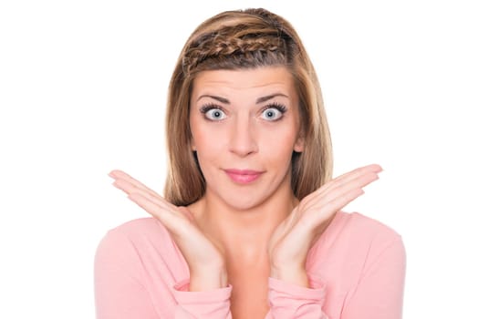 Astonished young woman against a white background