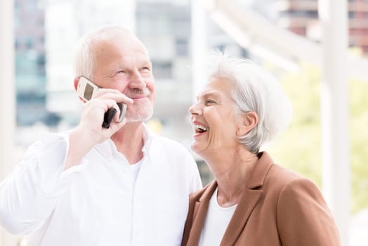 Active senior couple against an urban background