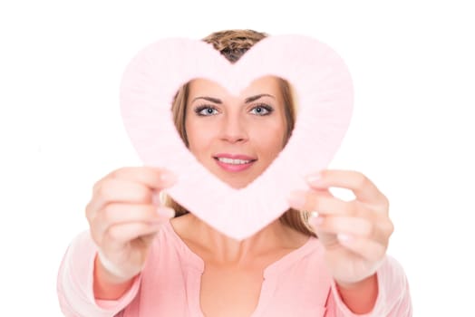 Portrait of a young woman with a pink heart against a white background
