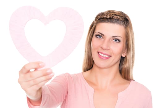 Portrait of a young woman with a pink heart against a white background