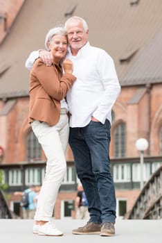 Active senior couple against an urban background