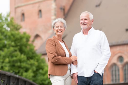 Active senior couple against an urban background