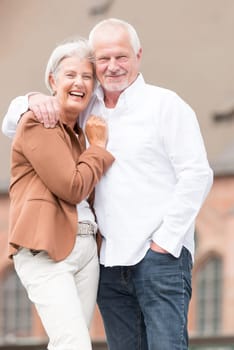 Active senior couple against an urban background