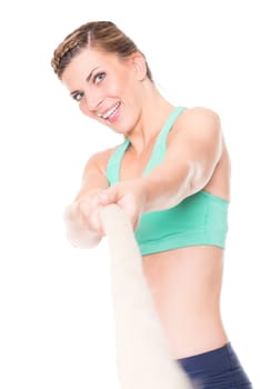 Studio recording of a young woman during the tug-of-war against a white background