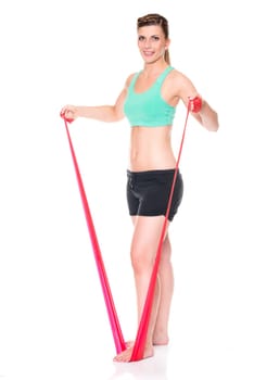 Studio recording of a young woman with a red gymnastics band against a white background