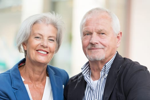 Active senior couple against an urban background