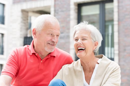 Active senior couple against an urban background