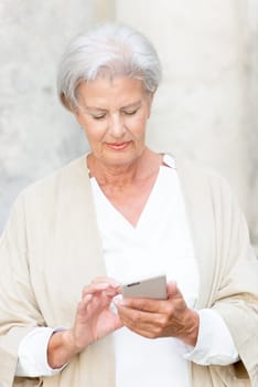 Smile senior citizen with smartphone