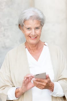 Smile senior citizen with smartphone