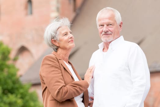 Active senior couple against an urban background