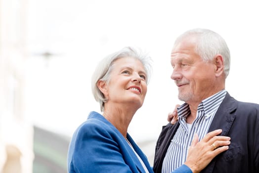 Active senior couple against an urban background