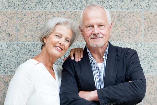 Active senior couple against an urban background