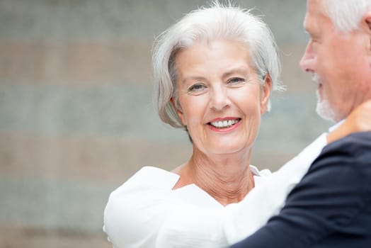 Active senior couple against an urban background