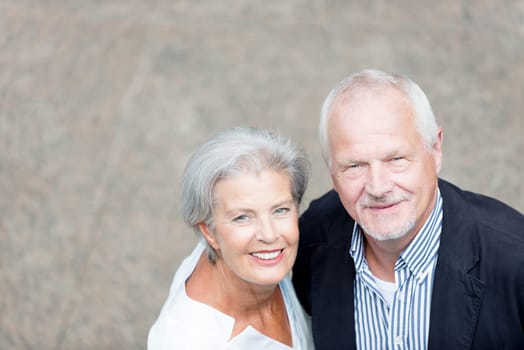 Active senior couple against an urban background