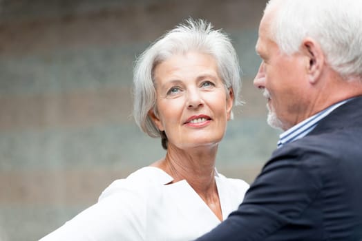 Active senior couple against an urban background