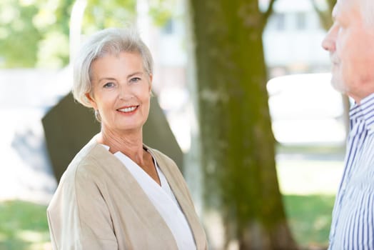 Active senior couple against an urban background