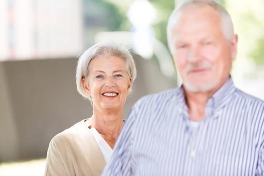 Active senior couple against an urban background