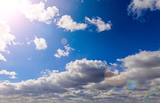 Blue sky with sun and clouds abstract background with copy space